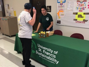 student selling honey