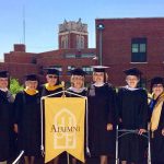 group of smiling 50th commencement alumni