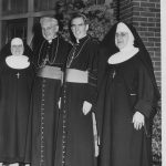 nuns with bishop smiling