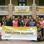 group of smiling alumni