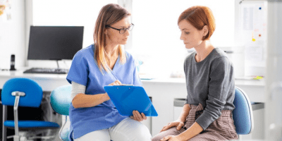 female nurse with a female patient