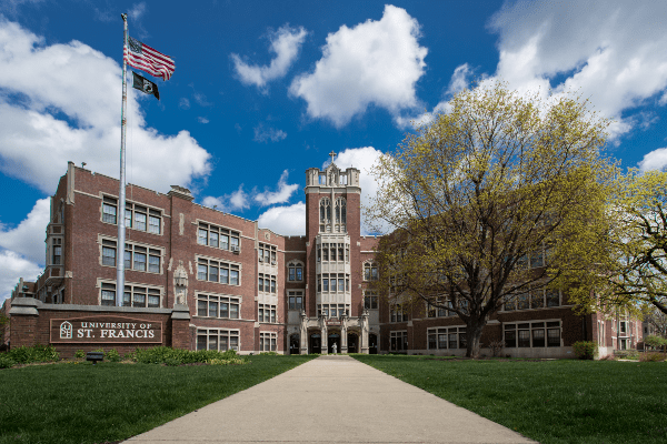 tall brick building named tower hall at the university of saint francis